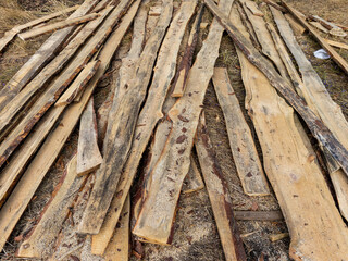 A pile of wood that is laying on the ground