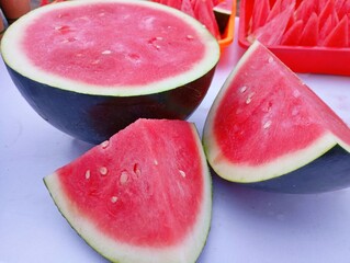 Fresh Sliced Watermelon. Juicy Red Watermelon Slices. Refreshing Summer Watermelon Snack. Ripe Watermelon Ready to Eat. Watermelon Display at a Market. Slice of Watermelon