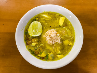 Photo of traditional Javanese food, chicken soto from Lamongan, taken from a top angle.