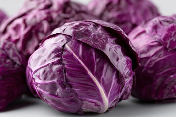 Obraz premium A bunch of red cabbage on a white surface
