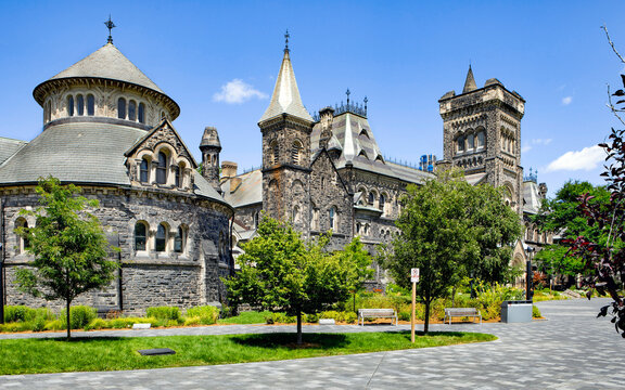 The University College Building at the St.George campus of The University of Toronto with walkway in foreground