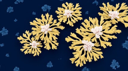 Clusters of stylized golden coral like sea anemones with white centers on a dark blue background