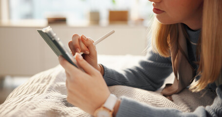 Tablet, relax and woman on bed with stylus for drawing, hobby or creative project on app for...