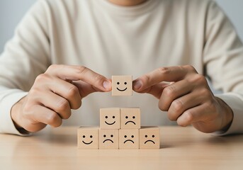 Hands Placing a Positive Feedback Block on a Customer Satisfaction Pyramid