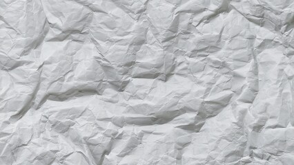 Fototapeta premium Crumpled white paper texture background with wavy surface. Crumpled white vintage paper surface texture for background. Wrinkled paper, abstract background. Paper background with copy space for text.