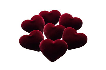 Fototapeta premium Group of plush red velvet hearts artfully arranged on a dark background isolated on transparent background