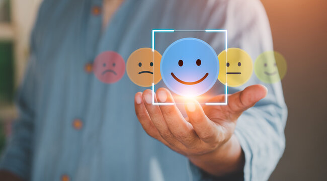 User holding blue paper cut happy smile face, Positive thinking, Mental health assessment, World mental health day concept, Positive feedback and reviews, great experience and service. emotion icon