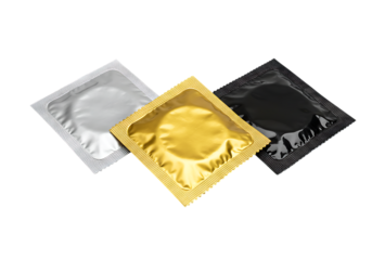 Three wrapped condoms in silver gold and black isolated on transparent background