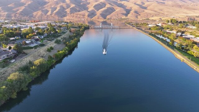 Boat on the Snake River With the Blue Bridge in the background