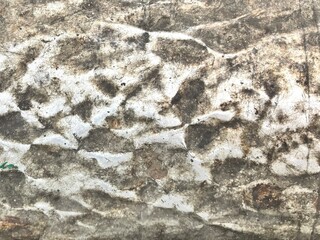 stone wall texture. Close-up of a weathered metal texture, showcasing natural corrosion and rustic patina. Perfect for backgrounds, overlays, and design elements. 