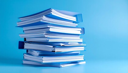 Stack of blue file folders with papers