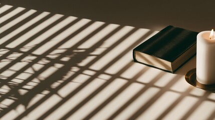 paperback horror novel on desk with glowing candle and mysterious shadows