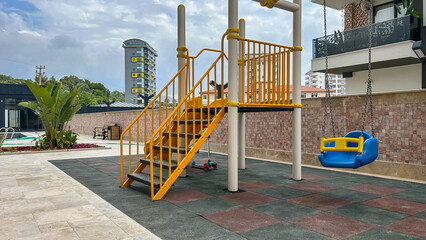 Colorful Playground With Slide And Swing In Residential Courtyard, Outdoor Daytime, Safe Rubber Flooring, Suitable For Family Housing Promotions, Child-Friendly Design, Urban Planning, Commercial Use