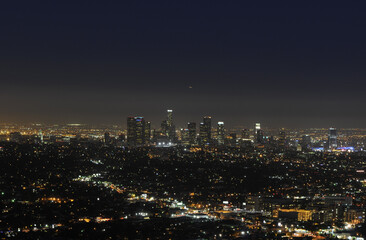 Los angeles at night with urban buildings. USA, New York City, New York, Aerial view of illuminated skyline at night.