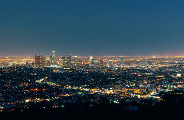 Obraz premium Los angeles at night with urban buildings. USA, New York City, New York, Aerial view of illuminated skyline at night.