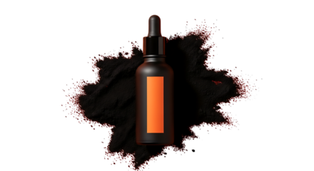 Black dropper bottle with orange label on a pile of black powder