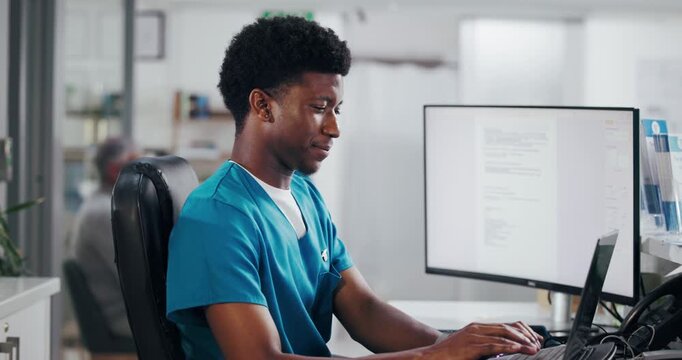 Happy man, nurse or receptionist typing with laptop for online booking or medical appointment. Male person, secretary or health assistant with computer at front desk for planning visit or schedule