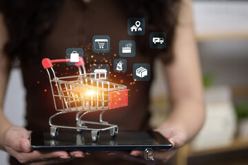 Online shopping cart with ecommerce icons on tablet