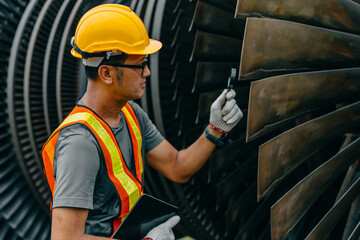 Professional Asian engineer male working service power plant turbine fan blade electrical generator