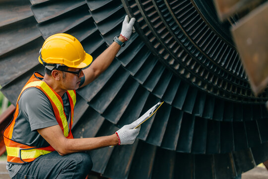 Professional Asian engineer male working service power plant turbine fan blade electrical generator