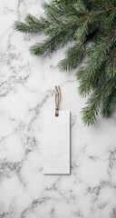 Blank gift tag on marble, fir branch