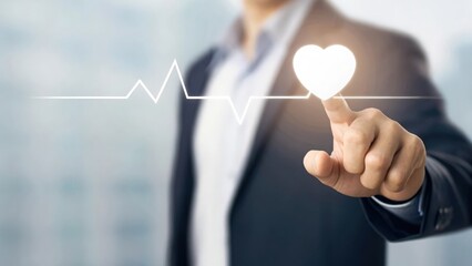 Business hand pressing a rising heartbeat icon — focus on growing health priorities
