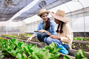 Young generation Z farm scientist educates outdoors about agricultural plants in greenhouse with enthusiasm and care for sustainable growth and learning in nature