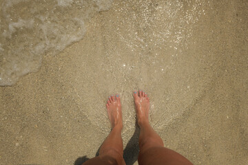 Feet in sand and waves blue nail polish Anna Maria Island