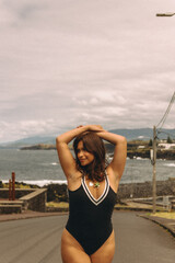 Young woman enjoying coastal breeze