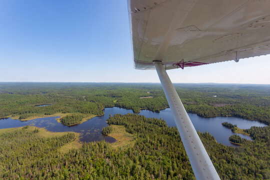 Aerial view of lakes and wilderness landscape from a plane