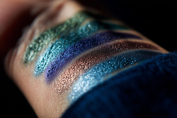 Close-up of Multi-Colored Shimmer Eyeshadow Swatches on Skin in Natural Light