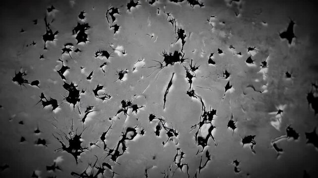4K high quality video grunge overlay showing spilled textures dirty stains moving over vintage video paper animated flickering dust particles scratches ideal horror tory aged effect