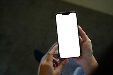 Female hand using mobile phone with empty display, suitable for UI design template