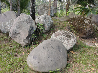 group of large stones on grassy ground in nature