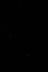 Grunge Dust Texture. High-resolution black background with subtle grunge dust and scratches.