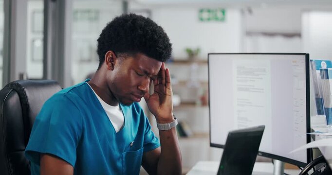 Frustrated man, nurse and receptionist with headache on laptop for stress, overworked or pressure. Male person, medical worker or secretary with migraine, strain or mistake on computer at front desk