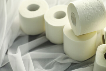 Toilet paper in a roll. Snow-white soft three-layer toilet paper. Lack of hygiene products. Primary protection and disinfection.