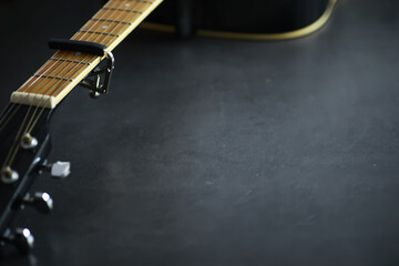 An acoustic guitar for an artist playing a stringed musical instrument on stage. Black guitar with...