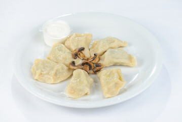 Ukrainian national dish varenyky on a white plate