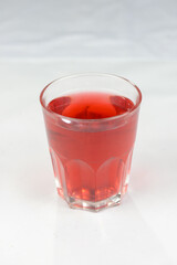 compote in a transparent glass on a white background