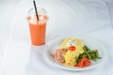 lunch porridge with omelette and bacon and vegetables with juice
