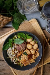 Thai noodle with sliced pork,meatball ,Thai morning glory ,bean sprouts,and blood soup