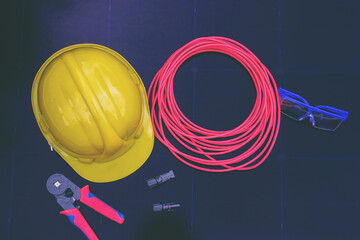 Solar Installation Tools and Safety Equipment on Solar Panel Surface