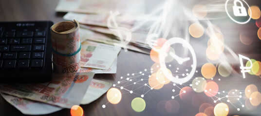 Russian rubles are on the table next to the computer, Notepad in the office or Bank. Savings and investments in the conditions of sanctions and inflation.