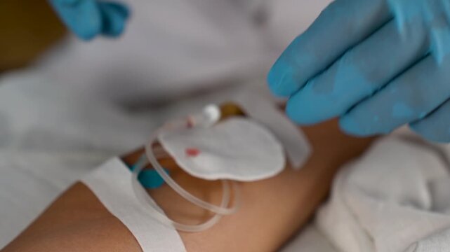 Doctor Prepares IV on Patient's Arm