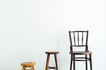 Three different wooden chairs in minimalist interior