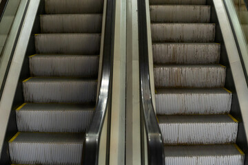 Symmetrical Escalator Steps Ascending Towards Progress And Success. Urban Escalator In Motion...