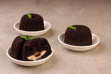 Black Glutinous Rice Bundt Cake With Cheese Filling or Bolu Ketan Hitam Keju Lumer.