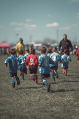 Energetic Youth Soccer Match Showcasing Teamwork and Community Spirit on a Sunny Day