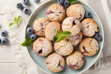 soft blueberry cookies made with fresh blueberries and flavored with lemon extract closeup in the bowl on the table. Horizontal top view from above